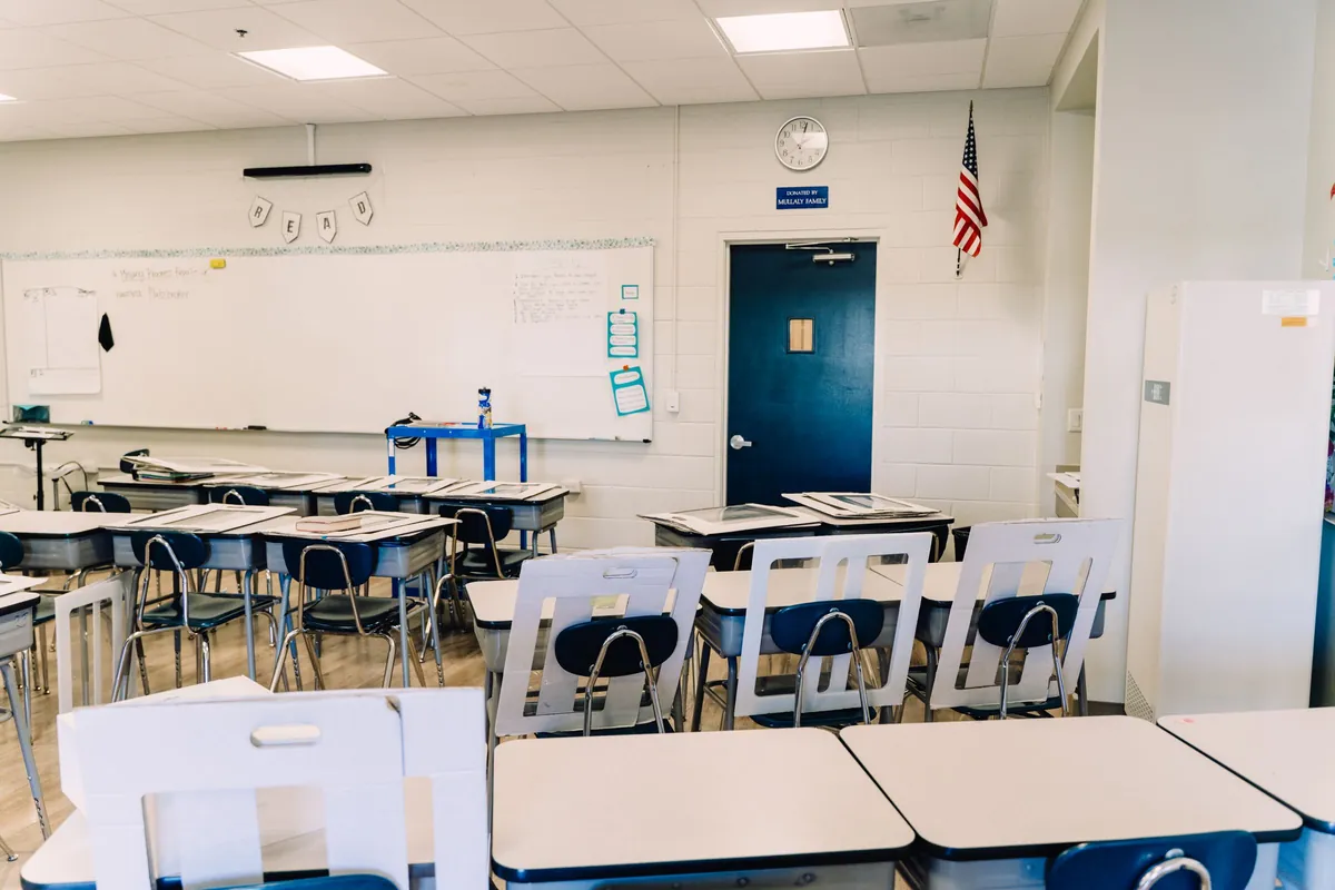 Classroom with rows of desks and a whiteboard