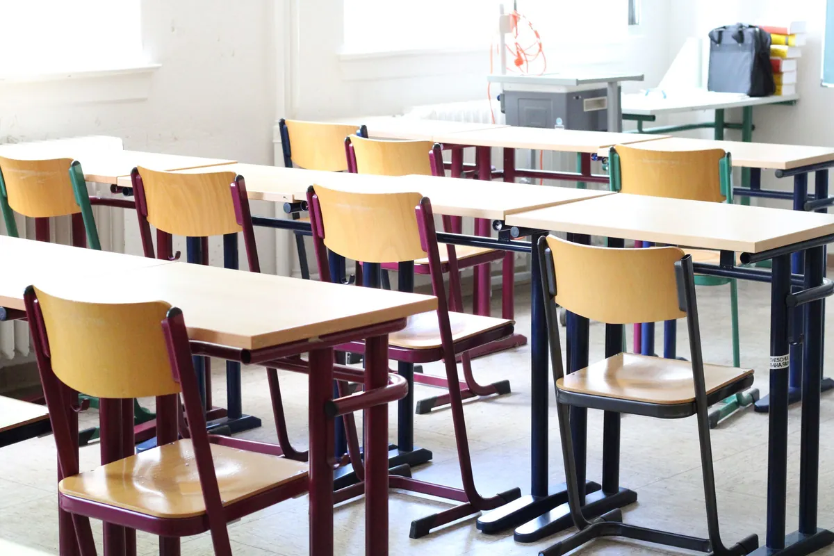 Classroom with wood desks and yellow chairs